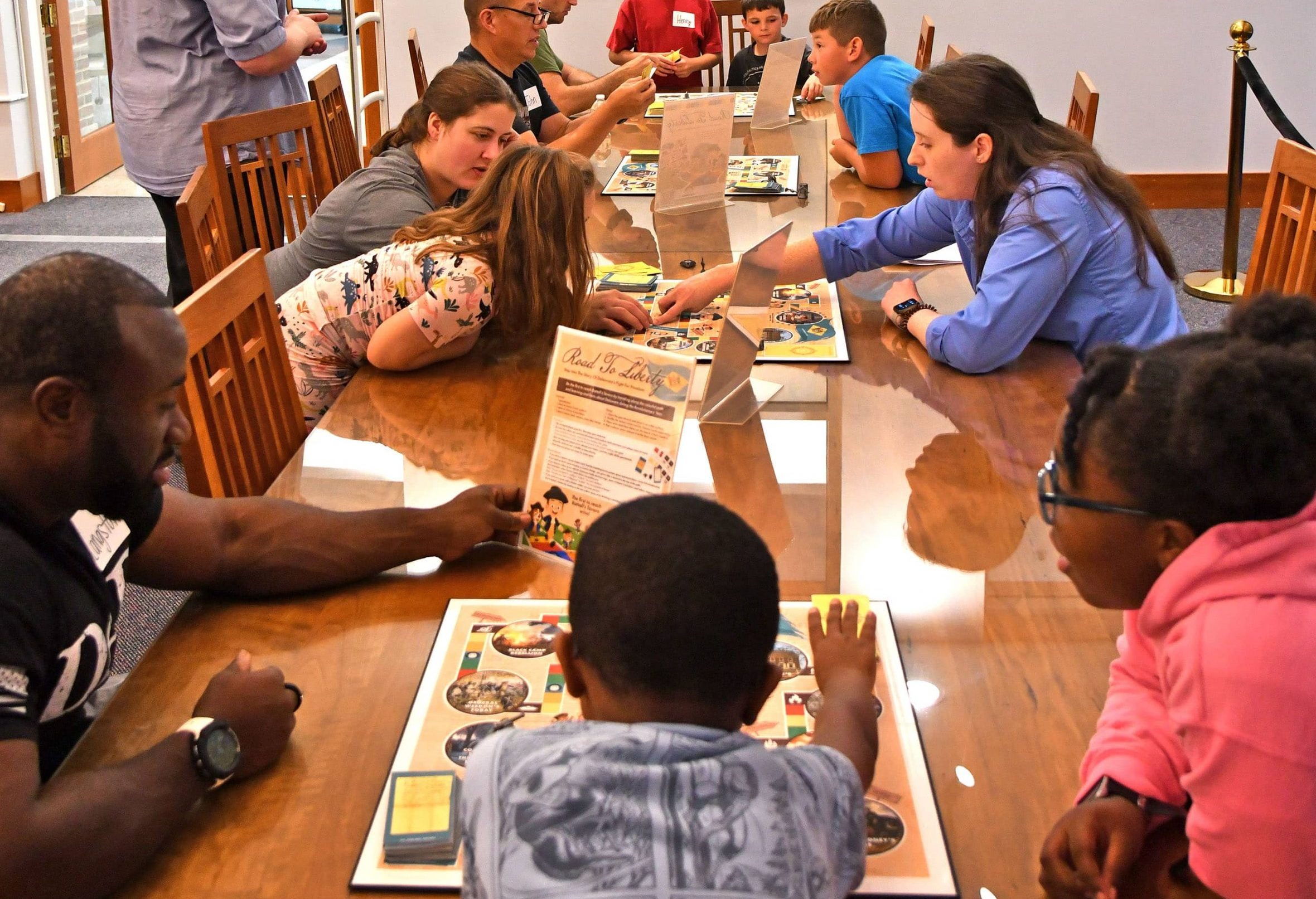 families play games during the overnight event at the archives.