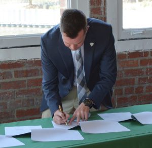Kyle Hoyd, Delaware State Forester, signs the Chesapeake Bay Shared Stewardship Agreement at the Anacostia River Center, in Washington, D.C., on Wednesday, Sept. 16. (Forest Service Photo/Dominic Cumberland)