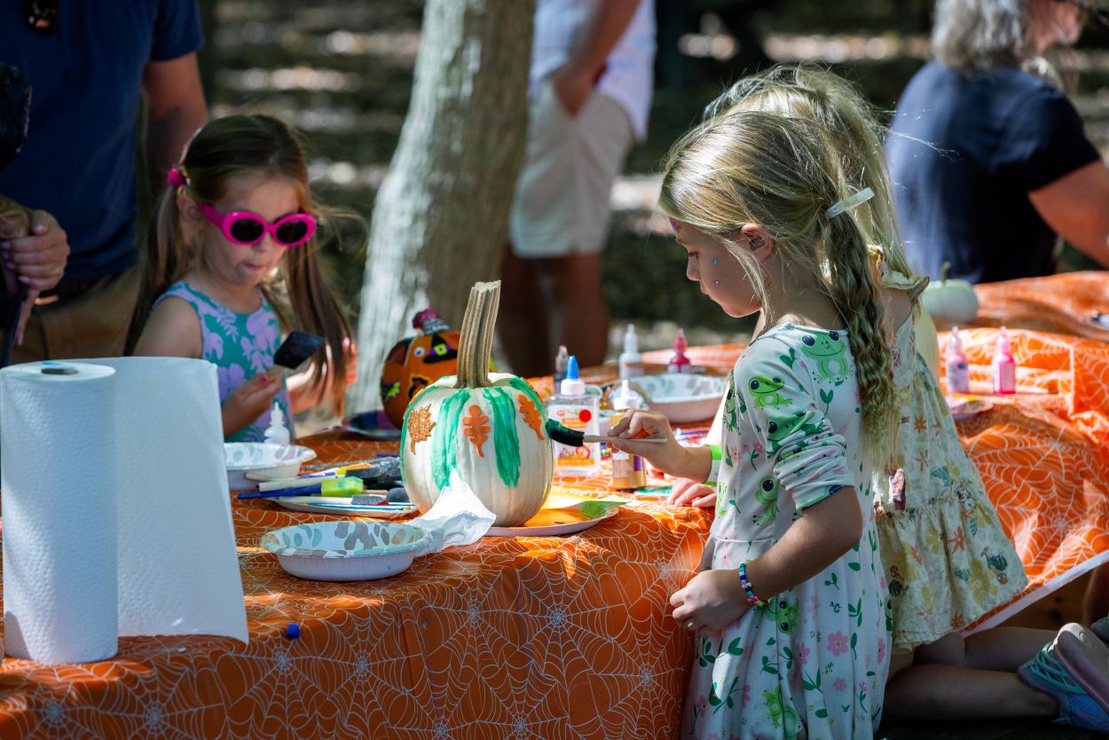 Two young girls decorate pumpkins at Pond Fest at Lums Pond State Park, which will be held this year on Oct. 10.
